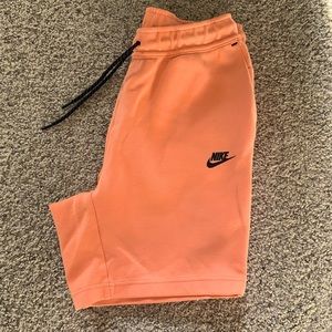 Nike pink/orange or peach 🤷 shorts.